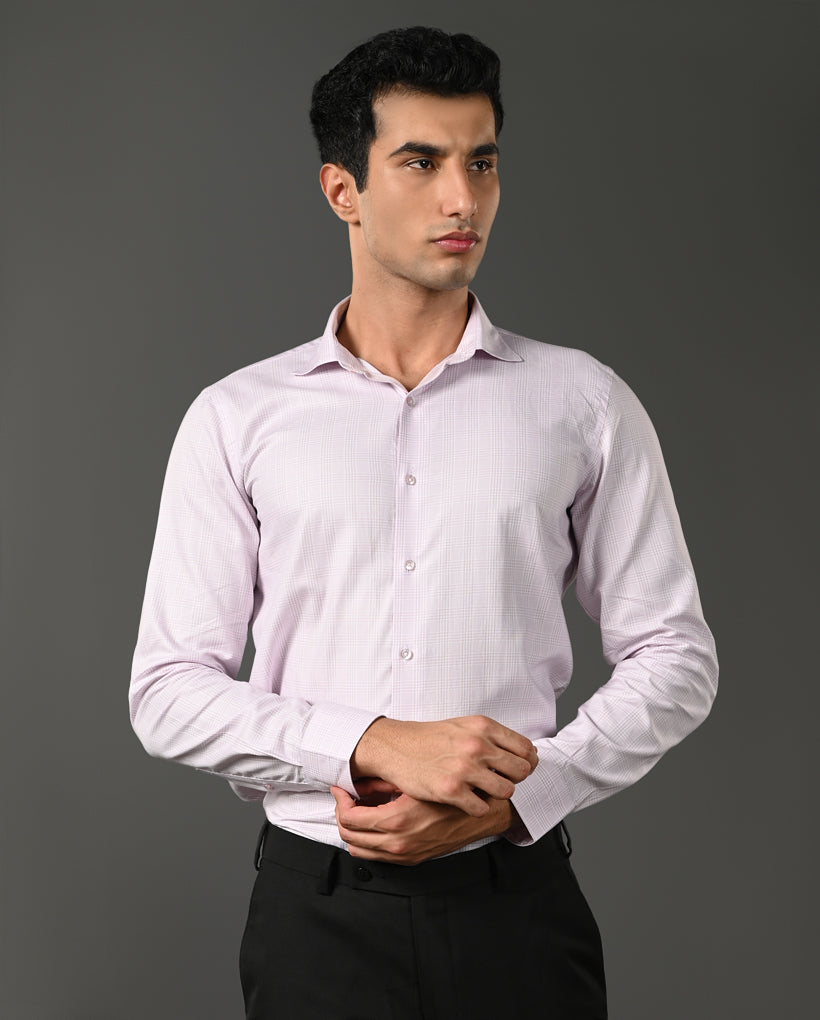 Man wearing a light purple dress shirt against a gray background