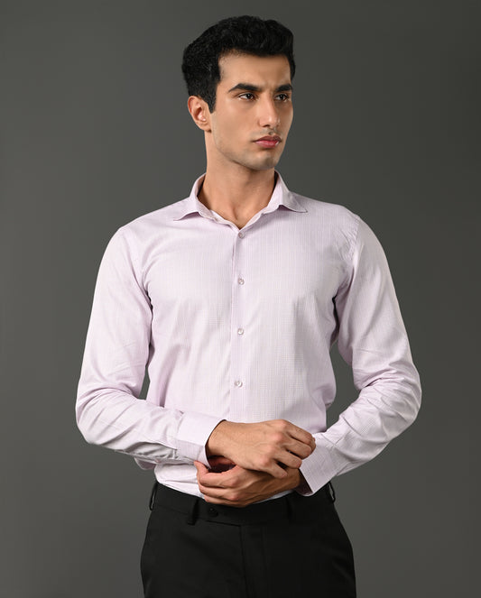 Man wearing a light purple dress shirt against a gray background