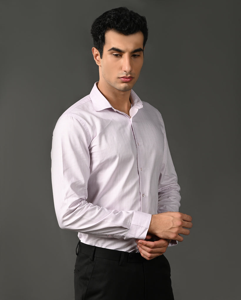 Man wearing a light purple dress shirt against a gray background