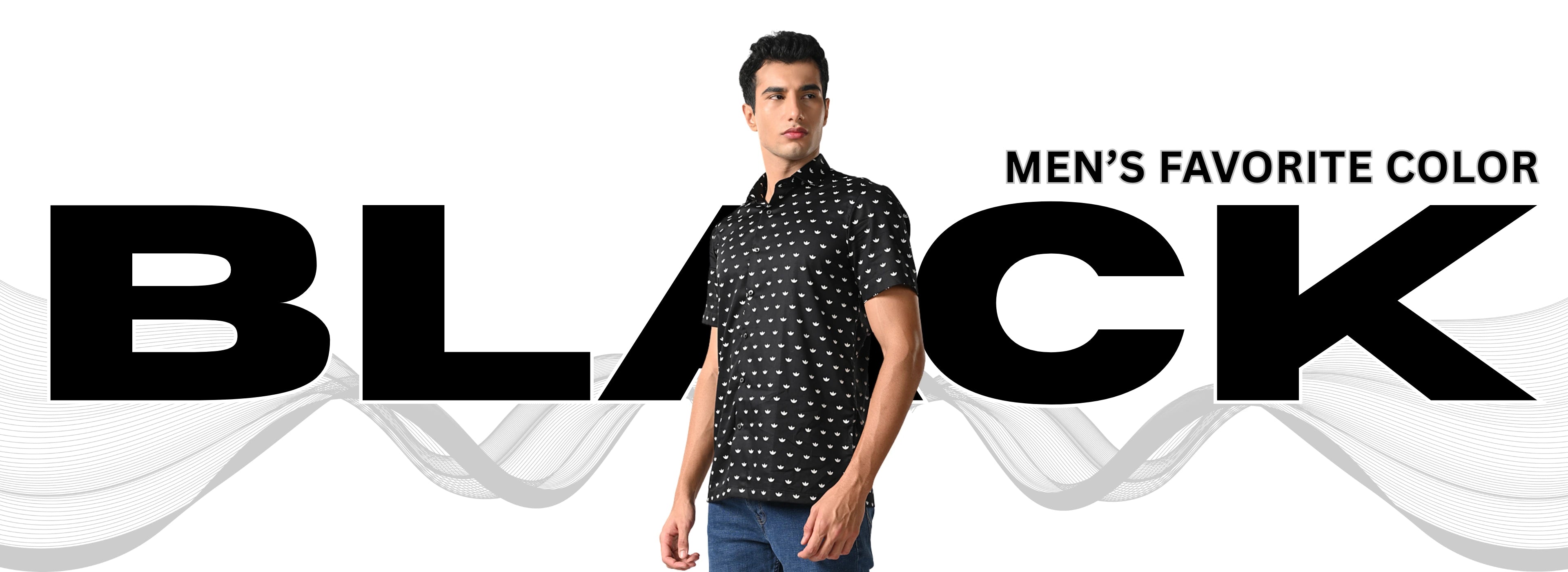 Man wearing a black patterned shirt with 'BLACK' text on a white background