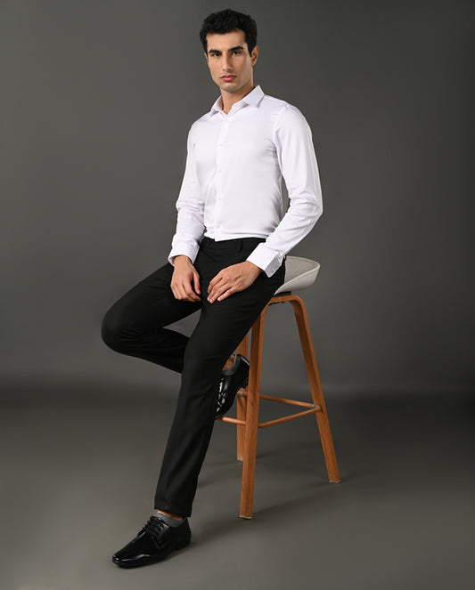 Close-up of a white dress shirt with collar and buttons on a gray background