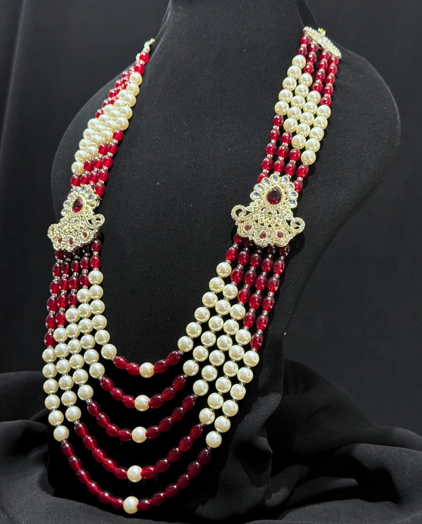 sherwani mala with red and cream beads for groom
traditional sherwani mala with kundan brooches
wedding sherwani mala for dulha
royal sherwani mala for groom look