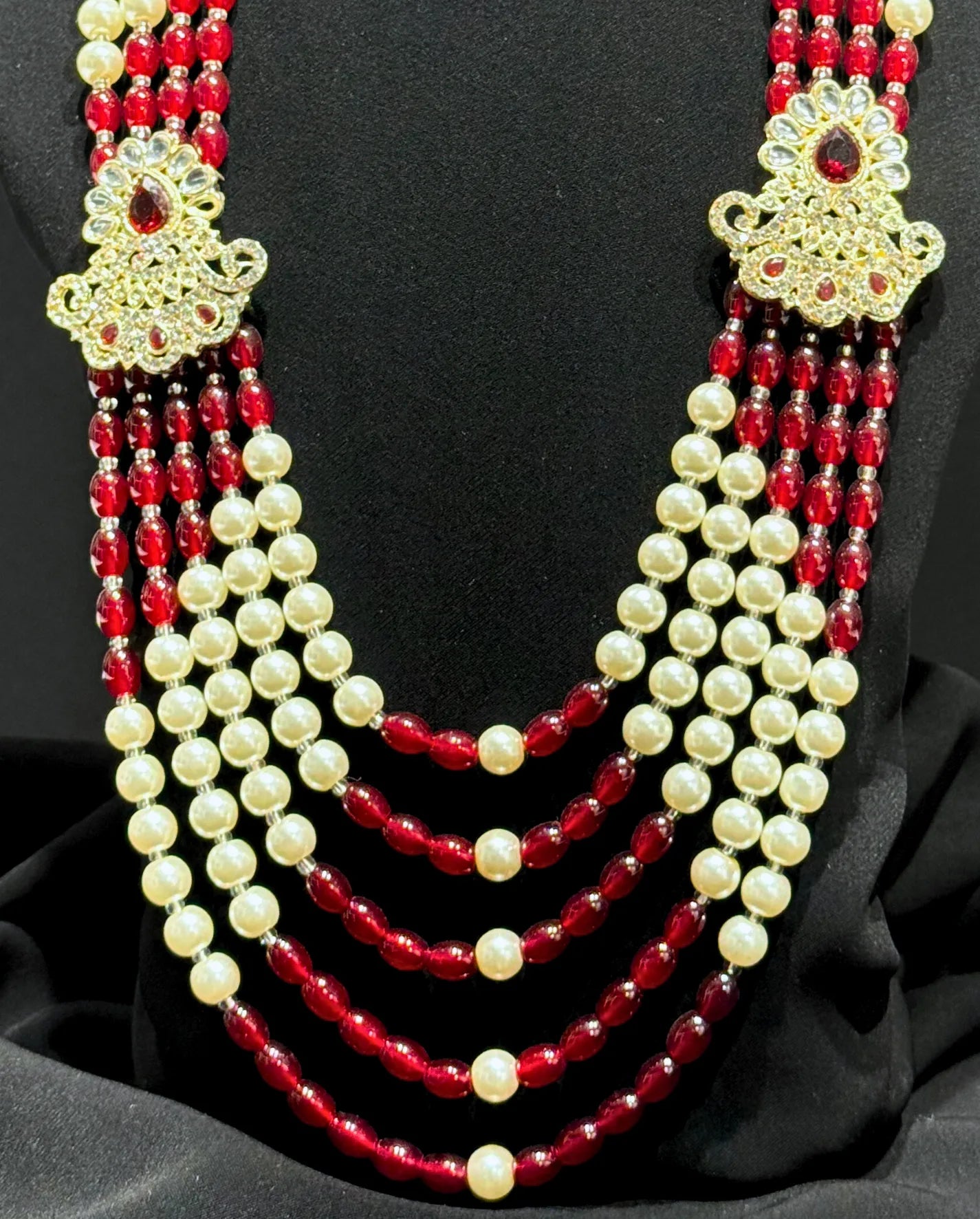 sherwani mala with red and cream beads for groom
traditional sherwani mala with kundan brooches
wedding sherwani mala for dulha
royal sherwani mala for groom look